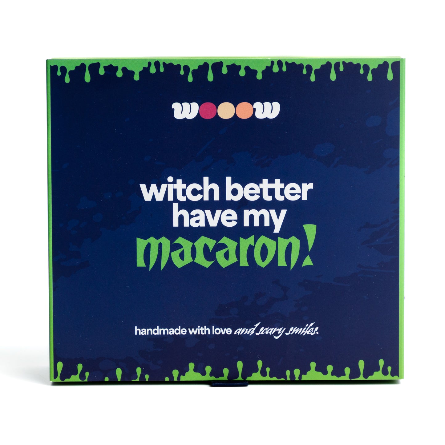 Front of Wooow Macarons Halloween box – “Witch better have my macaron” slogan on blue and green spooky themed packaging. Perfect Halloween gift box of macarons / macarrons.