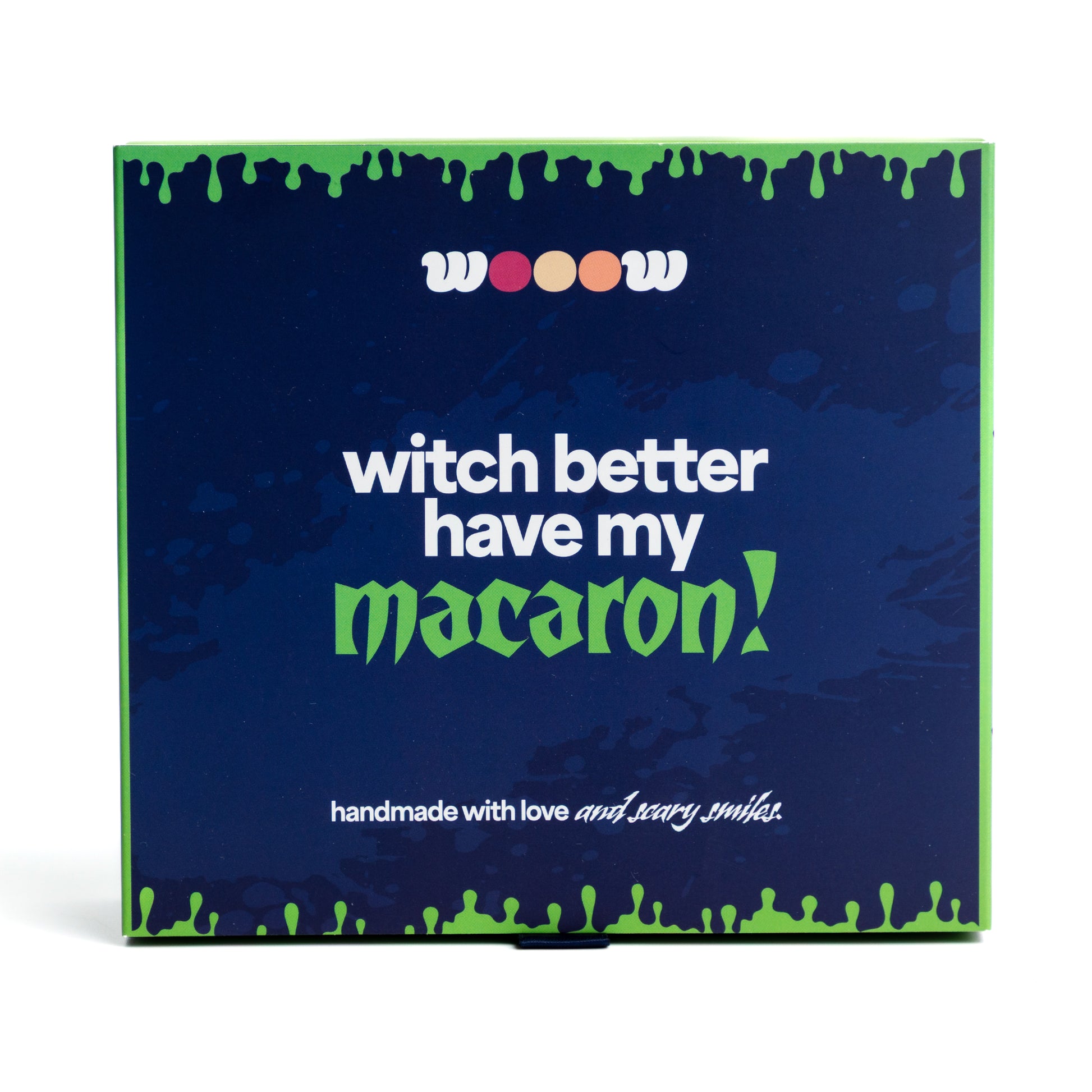 Front of Wooow Macarons Halloween box – “Witch better have my macaron” slogan on blue and green spooky themed packaging. Perfect Halloween gift box of macarons / macarrons.